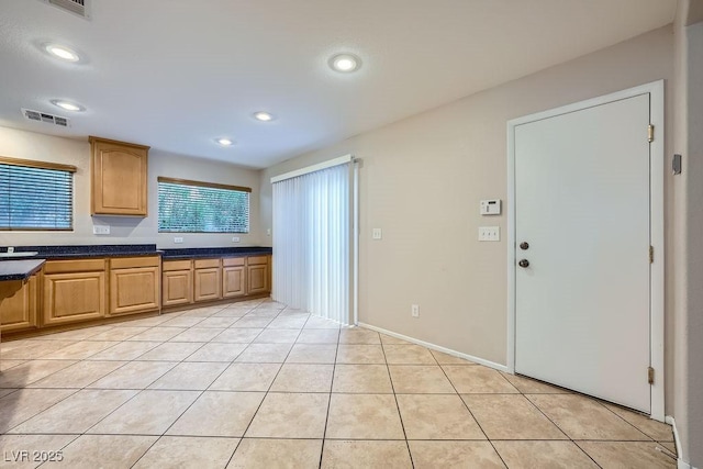 765 Jewel Tower St, Las Vegas, NV 89178 - kitchen with dark countertops, light tile patterned floors, recessed lighting, and a sink