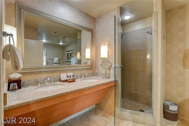 211 E Flamingo Rd Unit 615, Las Vegas, NV 89169 - bathroom featuring a stall shower, double vanity, and tile patterned flooring