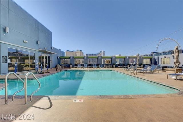 211 E Flamingo Rd Unit 615, Las Vegas, NV 89169 - community pool featuring a patio area
