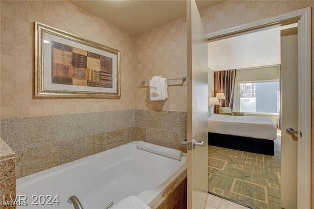211 E Flamingo Rd Unit 615, Las Vegas, NV 89169 - ensuite bathroom with tiled bath and tile patterned flooring