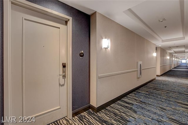 211 E Flamingo Rd Unit 615, Las Vegas, NV 89169 - corridor with carpet floors, a tray ceiling, and baseboards
