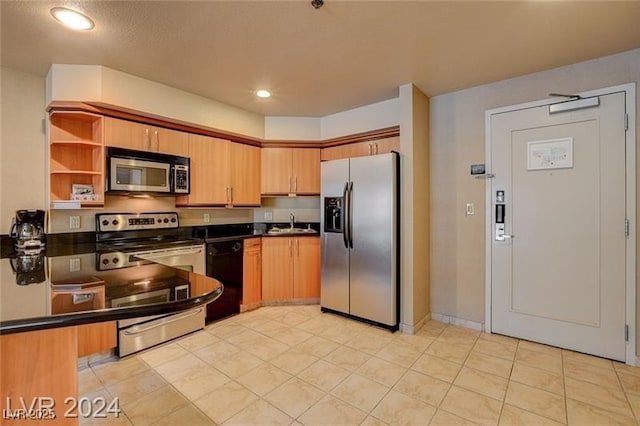 211 E Flamingo Rd Unit 615, Las Vegas, NV 89169 - kitchen with stainless steel appliances, dark countertops, a sink, recessed lighting, and open shelves