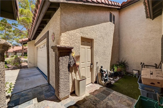 3987 Saddlewood Ct, Las Vegas, NV 89121 - view of home's exterior with stucco siding, a tile roof, driveway, and an attached garage