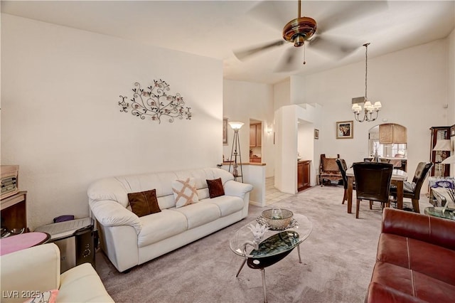 3987 Saddlewood Ct, Las Vegas, NV 89121 - living area featuring a chandelier, a ceiling fan, light carpet, and a towering ceiling
