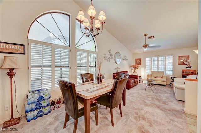 3987 Saddlewood Ct, Las Vegas, NV 89121 - dining room with vaulted ceiling, light colored carpet, a chandelier, and a ceiling fan