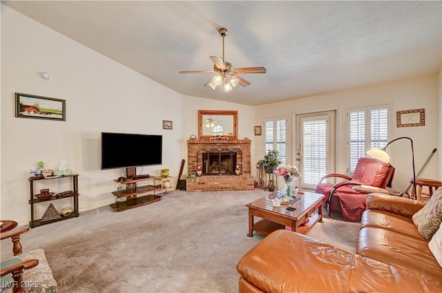3987 Saddlewood Ct, Las Vegas, NV 89121 - living room with a ceiling fan, carpet, lofted ceiling, a brick fireplace, and a textured ceiling