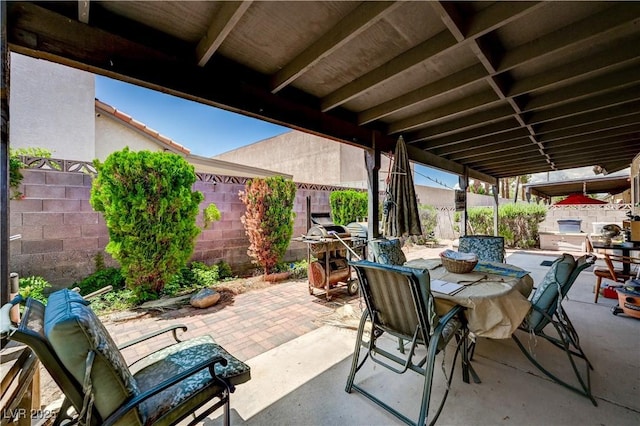 3987 Saddlewood Ct, Las Vegas, NV 89121 - fenced backyard featuring outdoor dining area and a patio area