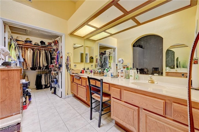 3987 Saddlewood Ct, Las Vegas, NV 89121 - full bath with double vanity, tile patterned floors, and a walk in closet