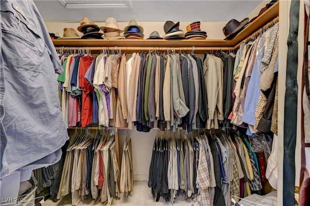 3987 Saddlewood Ct, Las Vegas, NV 89121 - walk in closet featuring attic access and tile patterned flooring