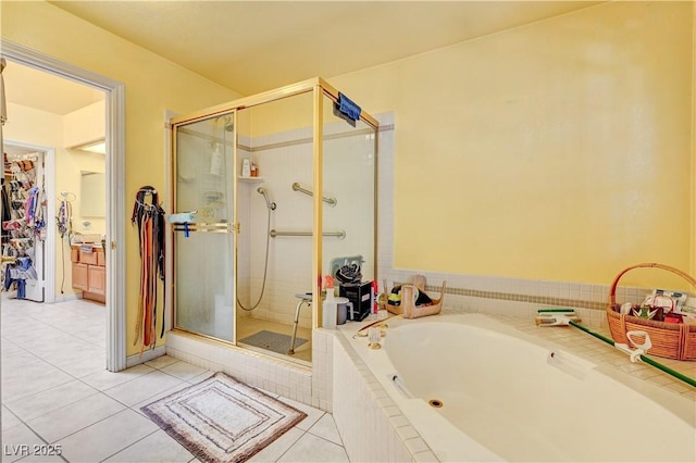 3987 Saddlewood Ct, Las Vegas, NV 89121 - bathroom featuring a stall shower, a garden tub, and tile patterned floors