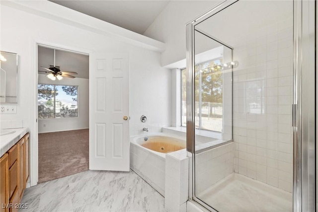 3580 S Shawnee Ave, Pahrump, NV 89048 - full bathroom with a garden tub, vanity, a stall shower, ceiling fan, and marble finish floors
