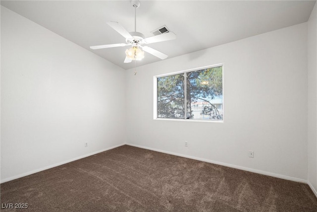 3580 S Shawnee Ave, Pahrump, NV 89048 - spare room featuring dark colored carpet, baseboards, ceiling fan, and vaulted ceiling