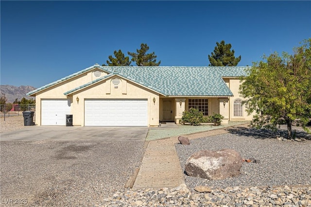 3580 S Shawnee Ave, Pahrump, NV 89048 - ranch-style home featuring stucco siding, an attached garage, concrete driveway, and a mountain view