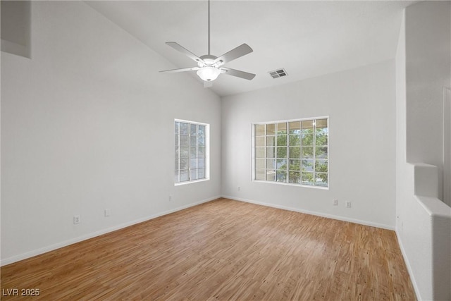 3580 S Shawnee Ave, Pahrump, NV 89048 - spare room featuring light wood-style flooring, ceiling fan, baseboards, and high vaulted ceiling
