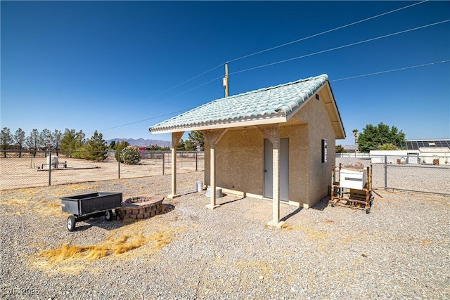 3580 S Shawnee Ave, Pahrump, NV 89048 - view of outbuilding with a fire pit