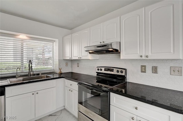 6944 Emerald Springs Ln, Las Vegas, NV 89113 - kitchen featuring appliances with stainless steel finishes, under cabinet range hood, light marble finish floors, white cabinets, and backsplash