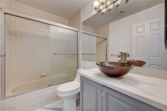 6944 Emerald Springs Ln, Las Vegas, NV 89113 - bathroom with vanity and bath / shower combo with glass door