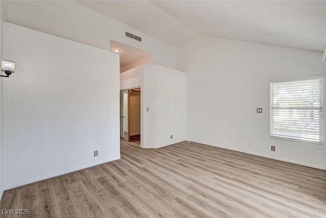 6944 Emerald Springs Ln, Las Vegas, NV 89113 - unfurnished room with vaulted ceiling and light wood finished floors