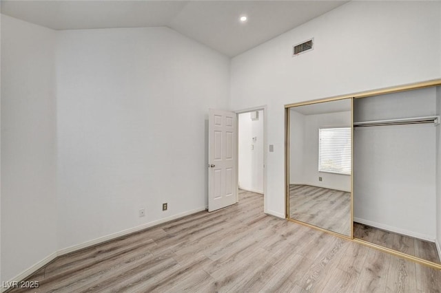 6944 Emerald Springs Ln, Las Vegas, NV 89113 - unfurnished bedroom featuring wood finished floors, vaulted ceiling, and a closet