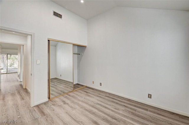 6944 Emerald Springs Ln, Las Vegas, NV 89113 - unfurnished bedroom with light wood finished floors, vaulted ceiling, a closet, and recessed lighting