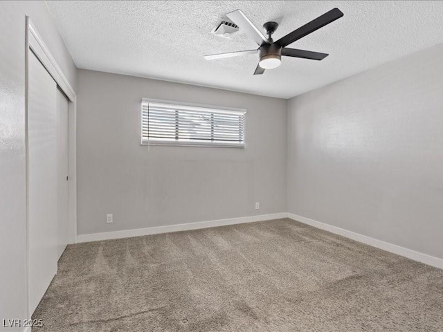 4204 El Jardin Ave, Las Vegas, NV 89102 - unfurnished bedroom featuring a textured ceiling, a closet, carpet, a ceiling fan, and baseboards