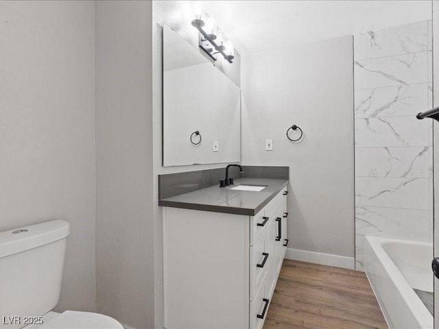 4204 El Jardin Ave, Las Vegas, NV 89102 - full bathroom with vanity, toilet, wood finished floors, and baseboards