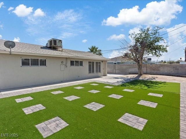4204 El Jardin Ave, Las Vegas, NV 89102 - rear view of house with stucco siding, central AC, and a patio area