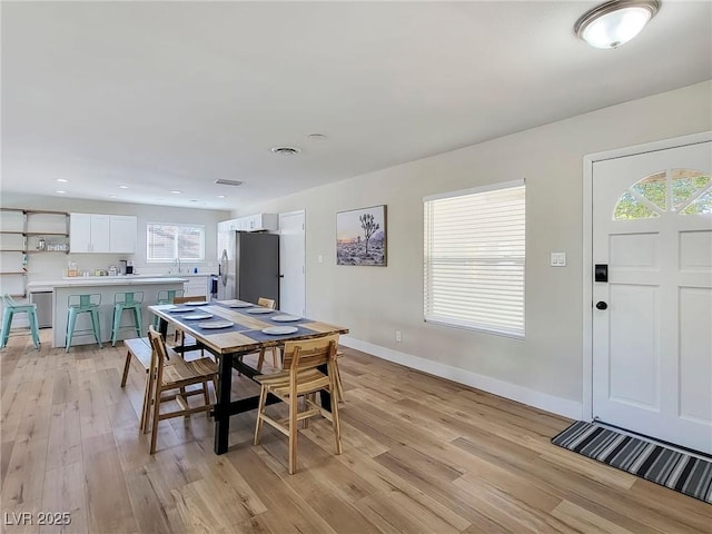 4072 E Harmon Ave, Las Vegas, NV 89121 - dining area with light wood-style flooring, baseboards, and recessed lighting