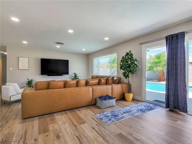 4072 E Harmon Ave, Las Vegas, NV 89121 - living area featuring light wood-type flooring, recessed lighting, and baseboards