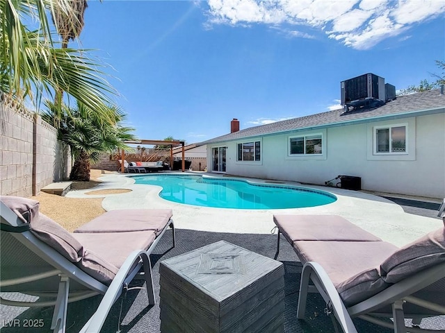 4072 E Harmon Ave, Las Vegas, NV 89121 - view of pool with central AC unit, a patio, and a fenced backyard