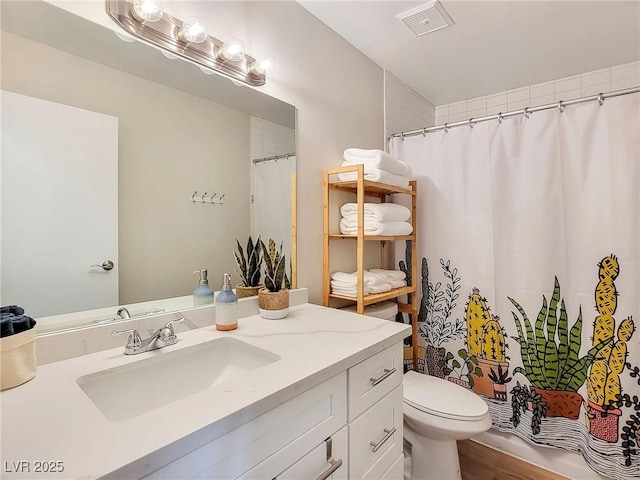 4072 E Harmon Ave, Las Vegas, NV 89121 - bathroom with vanity, toilet, and curtained shower