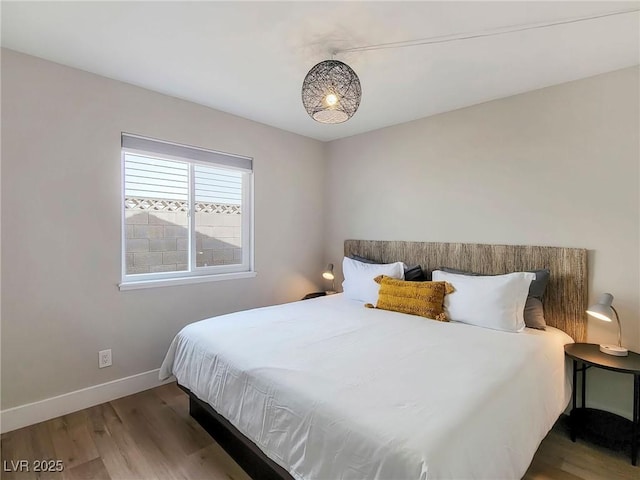 4072 E Harmon Ave, Las Vegas, NV 89121 - bedroom featuring wood finished floors and baseboards