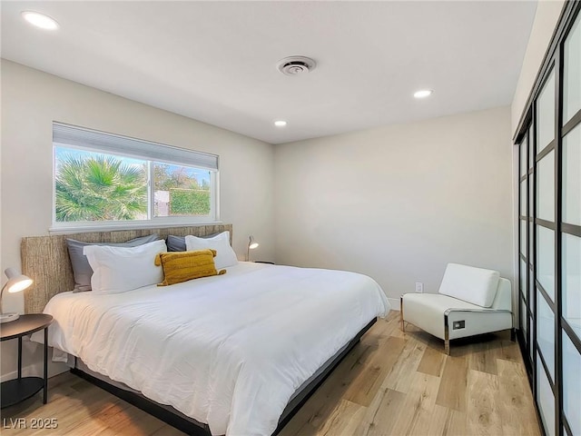 4072 E Harmon Ave, Las Vegas, NV 89121 - bedroom featuring light wood-type flooring and recessed lighting