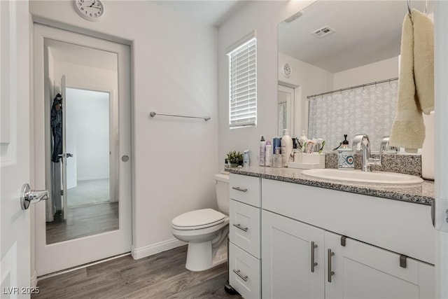 12110 Midnight Pine Rd Unit 4, Las Vegas, NV 89183 - bathroom with vanity, toilet, wood finished floors, and a shower with curtain