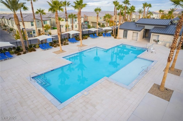 12110 Midnight Pine Rd Unit 4, Las Vegas, NV 89183 - community pool featuring a residential view and a patio