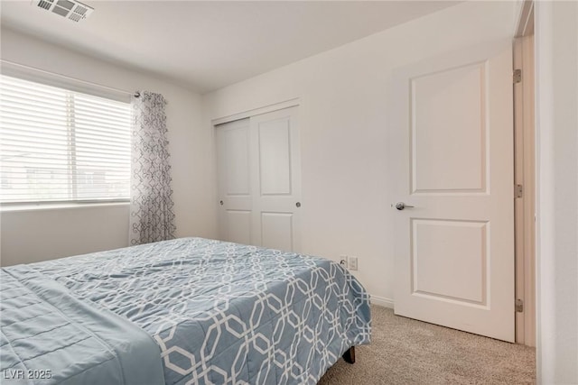 12110 Midnight Pine Rd Unit 4, Las Vegas, NV 89183 - bedroom with light colored carpet and a closet