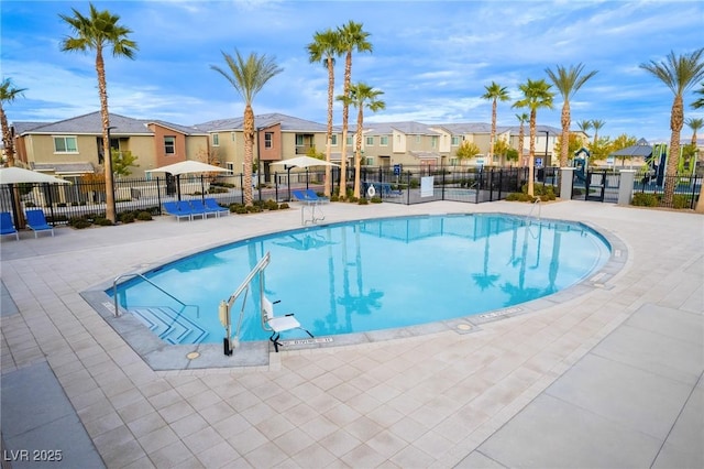 12110 Midnight Pine Rd Unit 4, Las Vegas, NV 89183 - community pool featuring a residential view and a patio