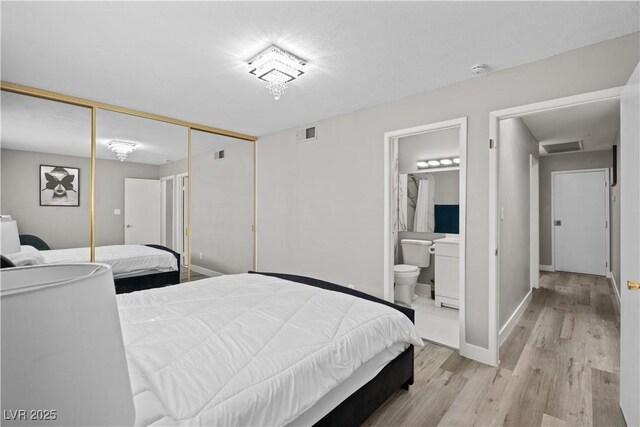 5375 Chestnut St, Las Vegas, NV 89119 - bedroom featuring light wood-type flooring, a closet, and ensuite bathroom