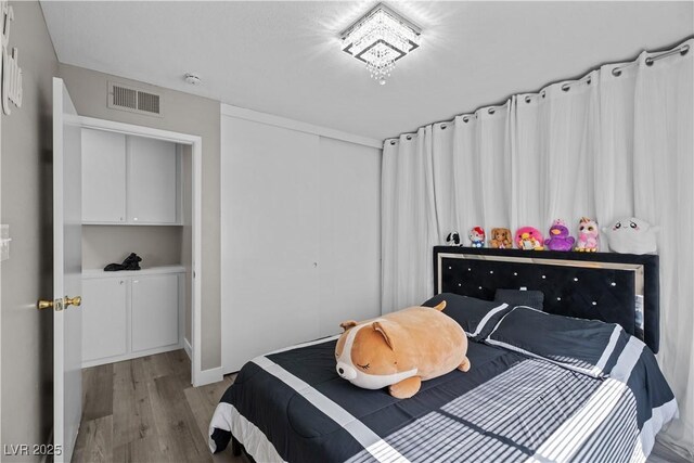 5375 Chestnut St, Las Vegas, NV 89119 - bedroom featuring light wood-type flooring and a closet