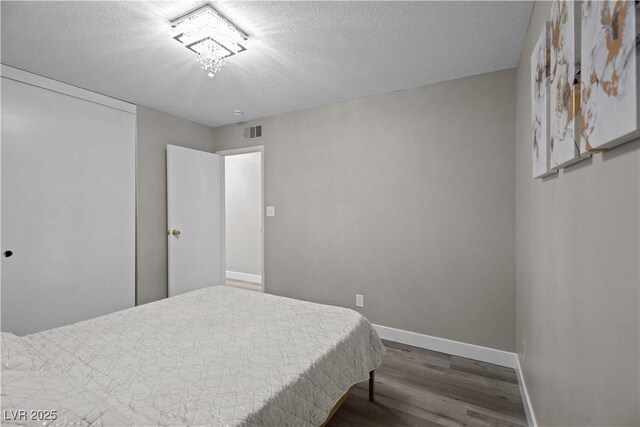 5375 Chestnut St, Las Vegas, NV 89119 - bedroom featuring wood finished floors and a textured ceiling
