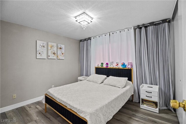 5375 Chestnut St, Las Vegas, NV 89119 - bedroom with dark wood-type flooring and a textured ceiling