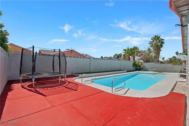 5375 Chestnut St, Las Vegas, NV 89119 - view of pool with a trampoline, a patio, and a fenced backyard
