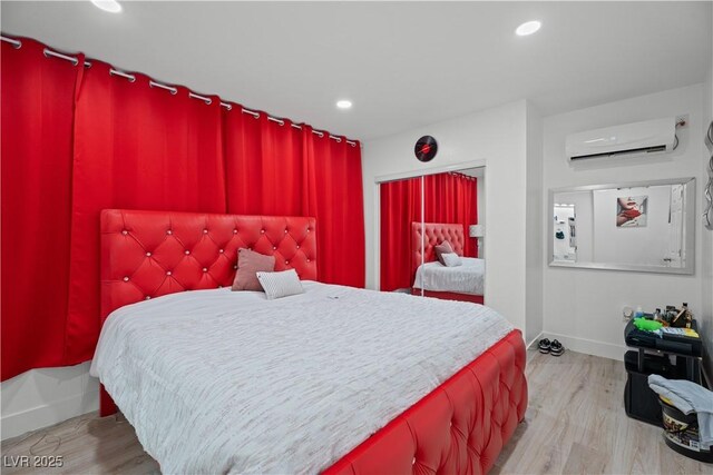 5375 Chestnut St, Las Vegas, NV 89119 - bedroom featuring a wall unit AC, wood finished floors, and recessed lighting