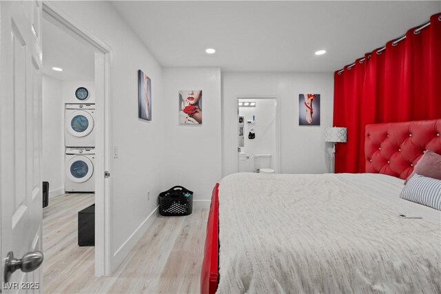 5375 Chestnut St, Las Vegas, NV 89119 - bedroom featuring stacked washer / dryer, wood finished floors, recessed lighting, and ensuite bathroom