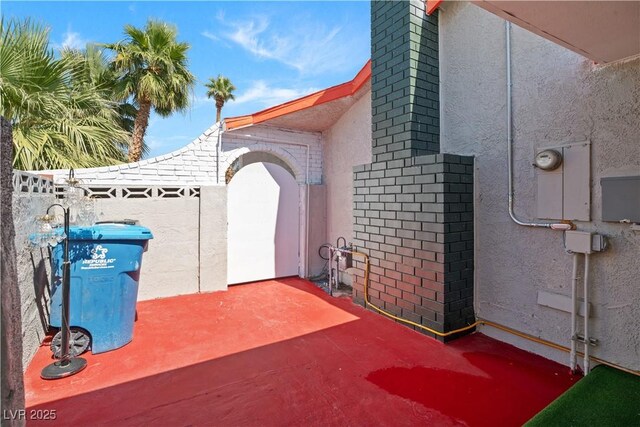 5375 Chestnut St, Las Vegas, NV 89119 - view of property exterior featuring stucco siding, brick siding, and a patio area