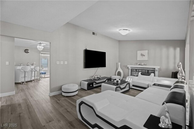 5375 Chestnut St, Las Vegas, NV 89119 - living area with wood finished floors and ceiling fan
