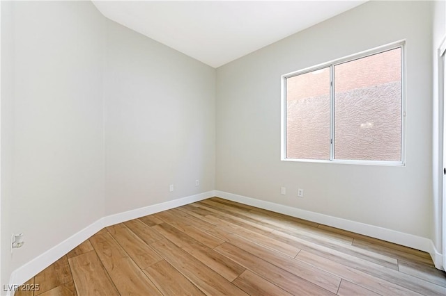 10017 Snow Crest Pl, Las Vegas, NV 89134 - spare room with light wood-style floors and baseboards