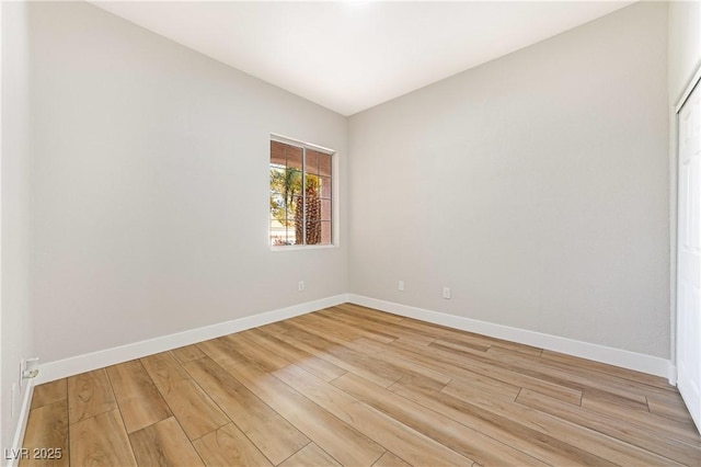 10017 Snow Crest Pl, Las Vegas, NV 89134 - unfurnished room with light wood-style flooring and baseboards