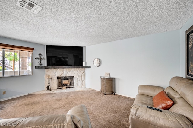7952 Diamond Rock Way Unit 102, Las Vegas, NV 89128 - living room featuring a fireplace, carpet floors, a textured ceiling, and baseboards