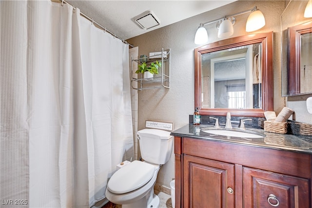 7952 Diamond Rock Way Unit 102, Las Vegas, NV 89128 - full bath featuring a textured wall, vanity, and a shower with curtain